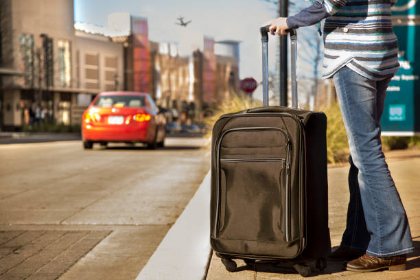 istock Woman traveling downtown with suitcases 641046178