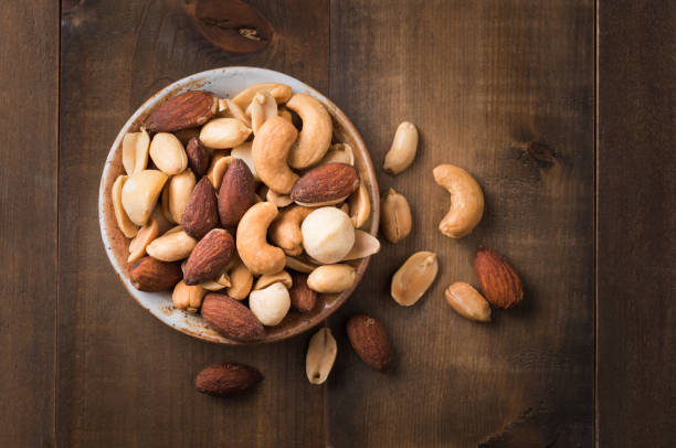 istock Mix cocktail nuts with salted on wood background 641046656
