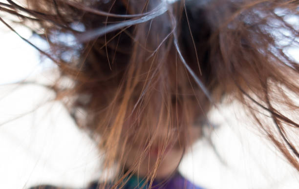 istock girl look down with messy hair blur abstract 641047596