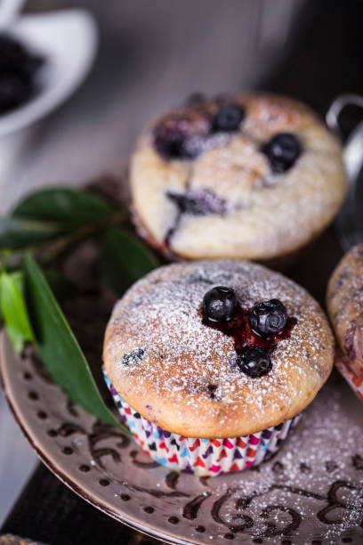 istock Blueberry muffins with powdered sugar 641051348