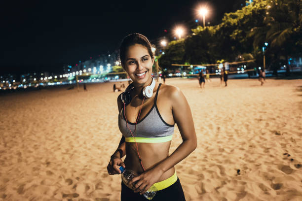 istock beautiful young fit woman relaxing after workout 641053628
