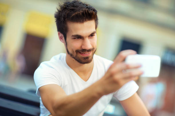 istock Young man making selfie with mobile phone 641056260