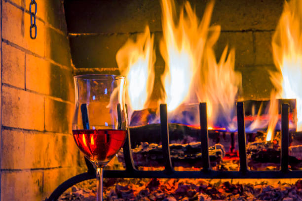 istock Glass of wine around the open fire. 641056694