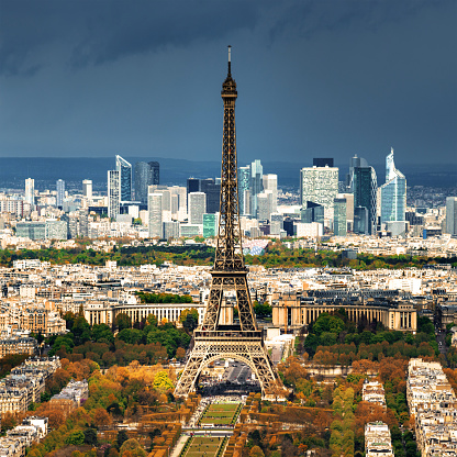 Aerial view of Paris with Champ-de-Mars, Eiffel Tower and skyscrapers of La Defense