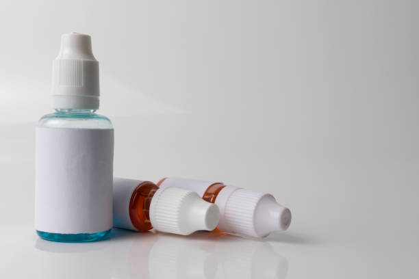 istock Isolated e liquid bottles for vaping devices and electronic cigarette on a white background. 641062008