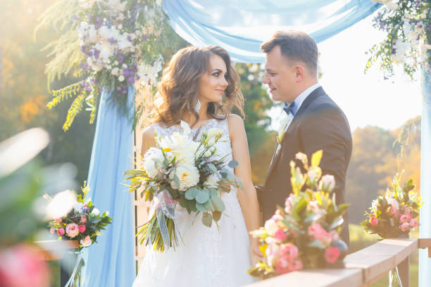 istock Elegant curly bride and happy groom 641064080