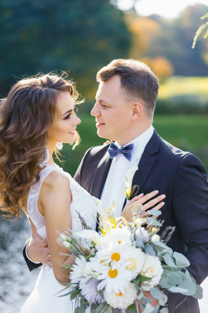 istock Elegant curly bride and happy groom 641064106