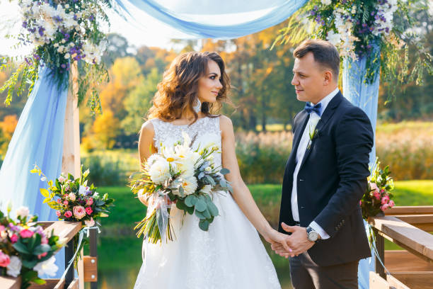 istock Elegant curly bride and happy groom 641064244