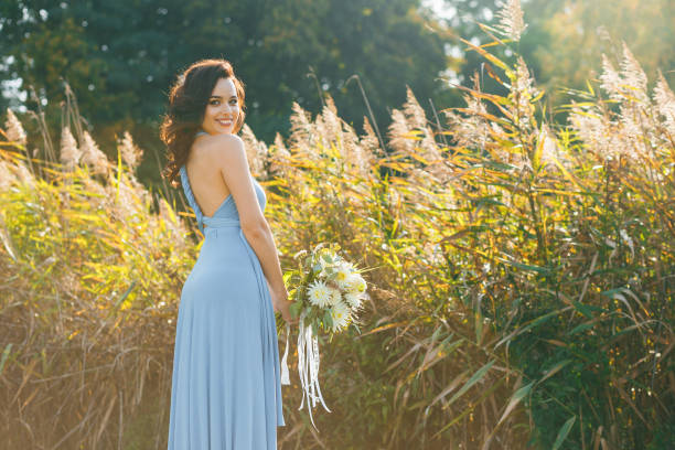 istock Beautiful young bridesmaid with curly hair 641064798