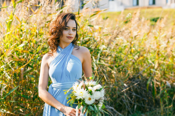 istock Beautiful young bridesmaid with curly hair 641064896