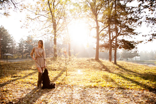 istock Woman in the local park during susnet 641065714