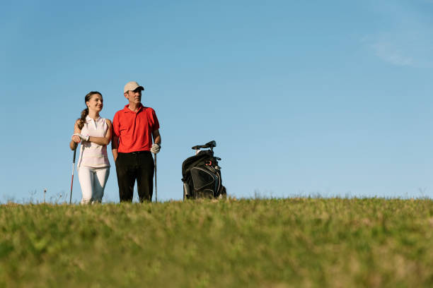 istock Golfer and Caddie playing golf. 641071182