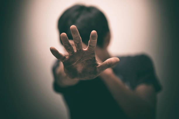 istock man show hands up facing the wall 641073060
