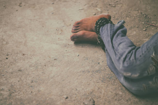 istock hopeless man feet tied together with rope 641073076