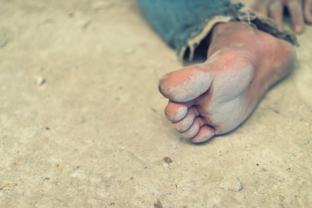 istock hopeless man feet tied together with rope 641073198