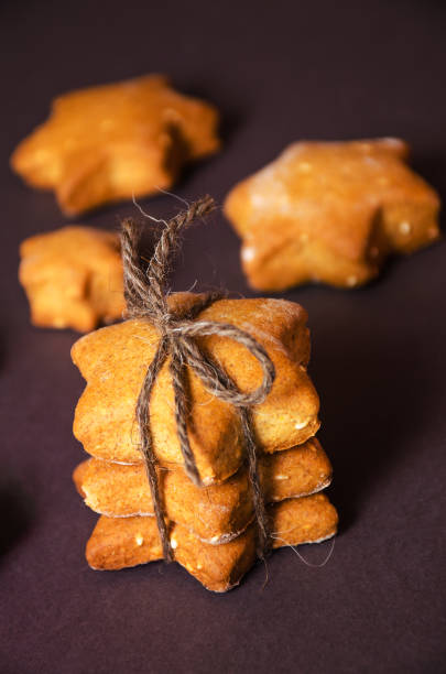 istock Homemade rye cookies star shaped stack tied with brown rope 641074274