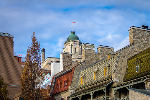Old houses rooftops and clock tower of the old post office building - Quebec City, Canada