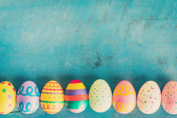 istock Colorful easter egg on blue pastel color wood background with space. 641077044
