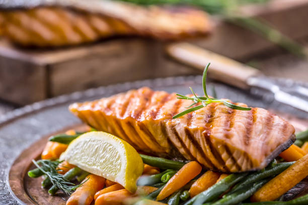 istock Raw salmon fillet pepper salt dill lemon and rosemary 641077896