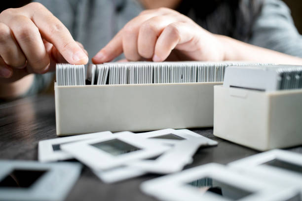 istock girl picking up reversal films and looking 641078378