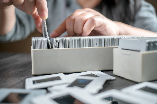 istock girl picking up reversal films and looking 641079148