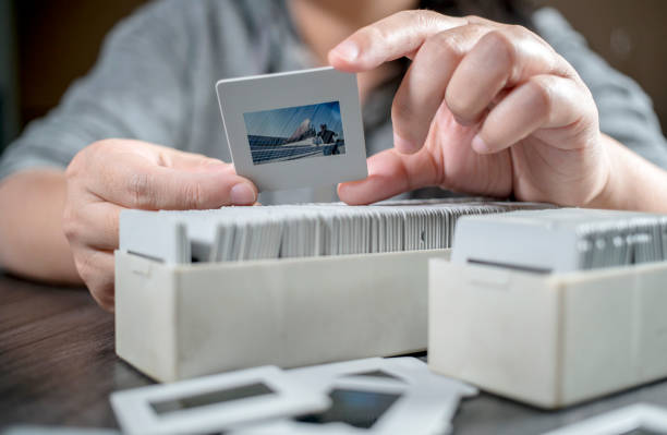 istock girl picking up reversal films and looking 641079208