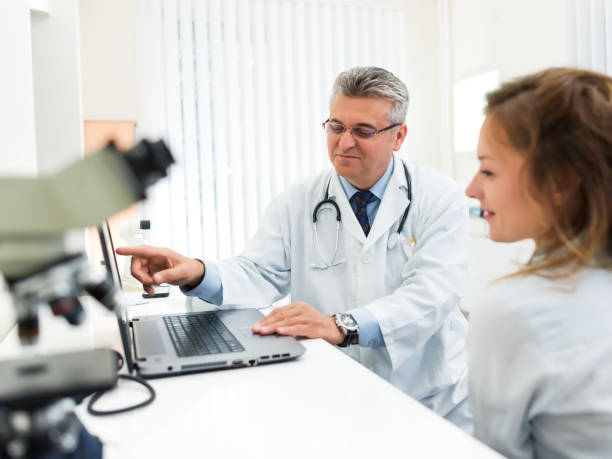 istock Doctor talking to his female patient 641082440