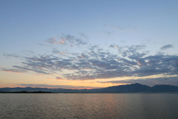 istock Beautiful sunset and evening sky with mountain and clouds at the beach for background. 641083022