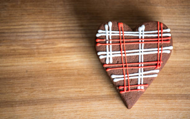 istock Chocolate cookies with red and white glaze. 641083924
