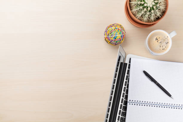 istock Office desk with laptop, coffee and cactus 641084210