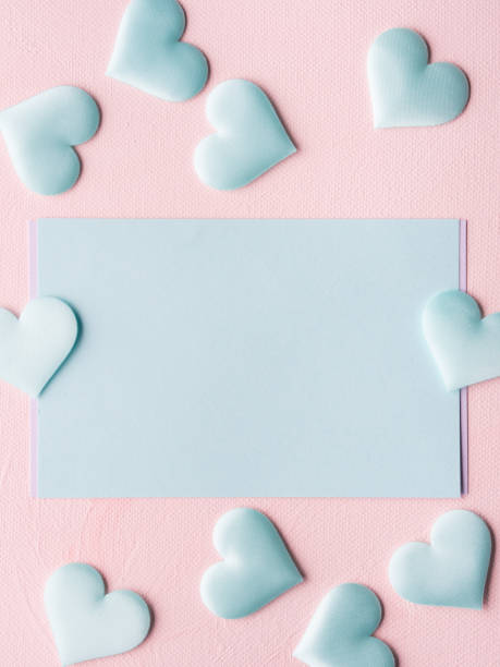 istock Green pastel card hearts on pink textured background 641086208