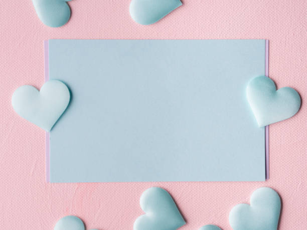 istock Green pastel card hearts on pink textured background 641086282