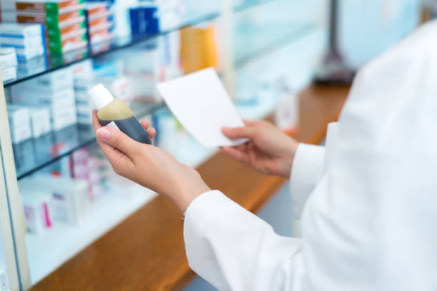 istock Female pharmacist in pharmacy with medicament 641087000