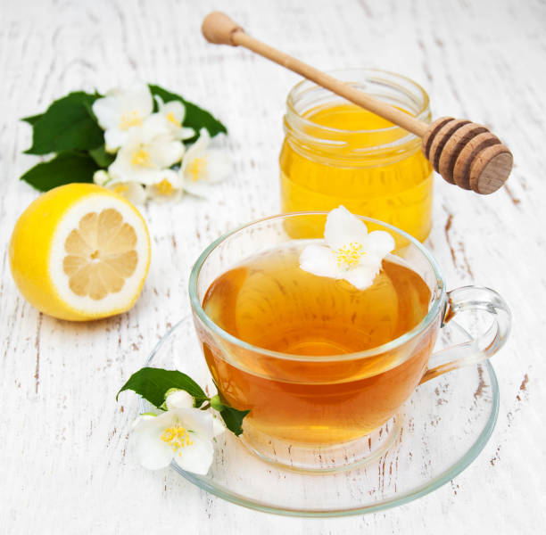 istock Cup of tea with jasmine flowers 641087328