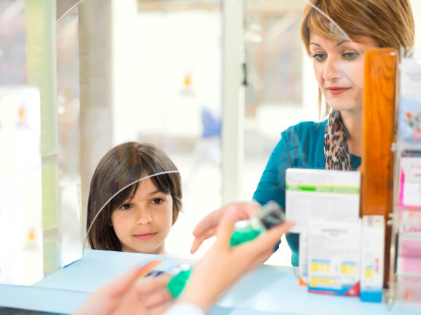 istock Mother with child at pharmacy 641088698