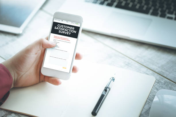 istock Smartphone in hand and showing Customer Satisfaction Survey concept 641089844