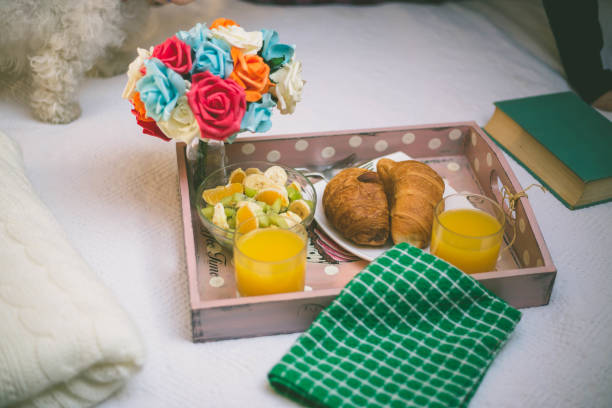 istock breakfast in bed with fruits and pastries on a tray 641108044