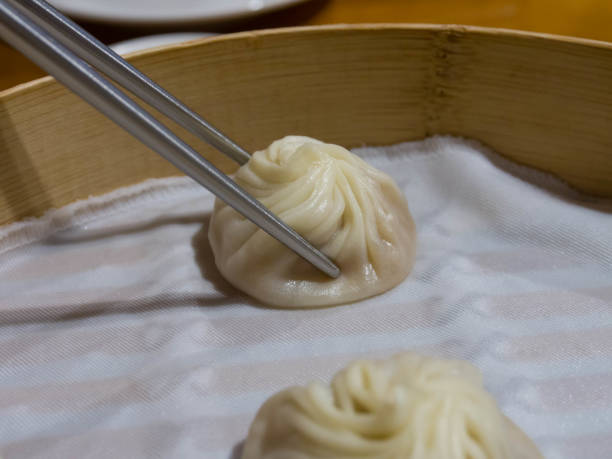istock Dim sum, Soup Dumplings (Xiao Long Bao) in wooden basket 641111610