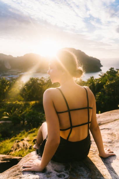 istock Woman looking at view of Koh Phi Phi at sunset 641112368