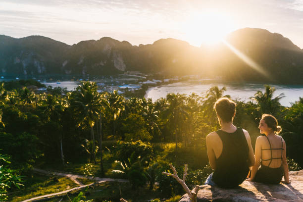 istock Couple  looking at view of Koh Phi Phi at sunset 641112372