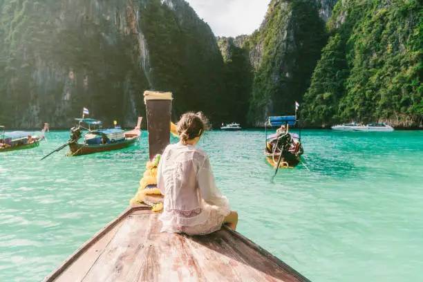 Young Caucasian woman in Thai Taxi boat in  Krabi, Thailand