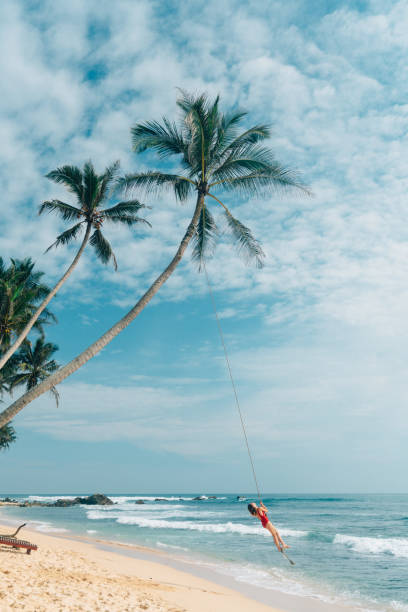 istock Woman playing on rope swing 641113520
