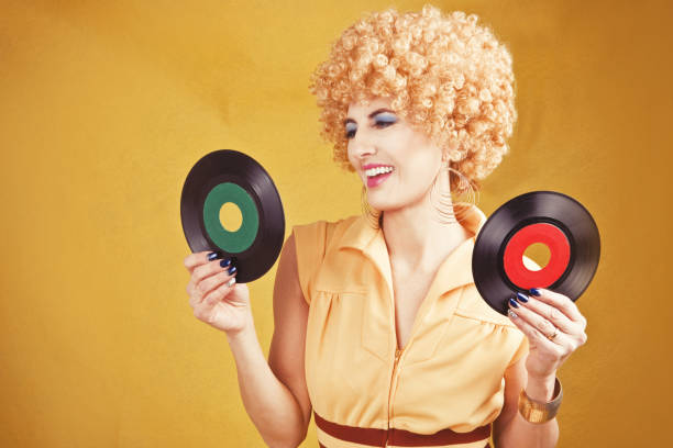 istock 70's Retro Woman Holding Records 641116806