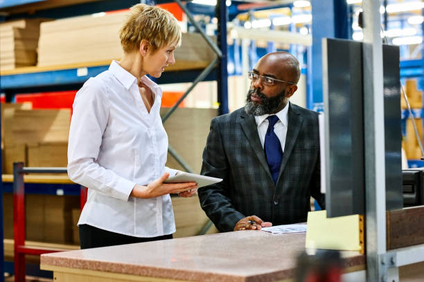 istock Business people working together in warehouse 641119268
