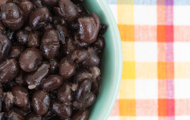 istock Organic black beans in a bowl on a place mat 641123050
