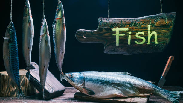 Assortment of fresh fish in traditional shop. Vintage style. Natural wood