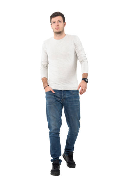 istock Confident young stylish man walking towards camera leisurely 641124234