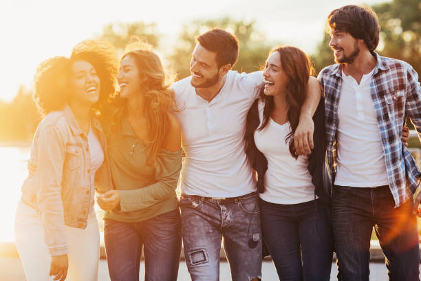 istock Group of happy young people outdoors at sunset 641126426