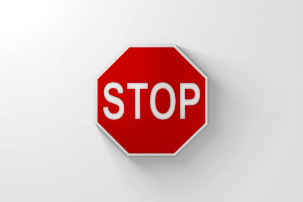 Red Stop Sign with Shadow over Bright White Background. 3D Illustration.  Lots of space for cropping.