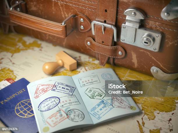 Travel Or Turism Concept Old Suitcase With Opened Passport Stock Photo - Download Image Now